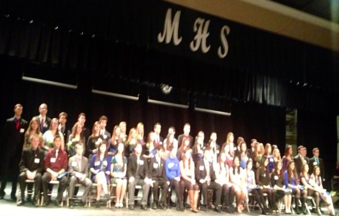 New member being inducted at the 2013 National Honor Society induction. Photo by Rose El-helou  