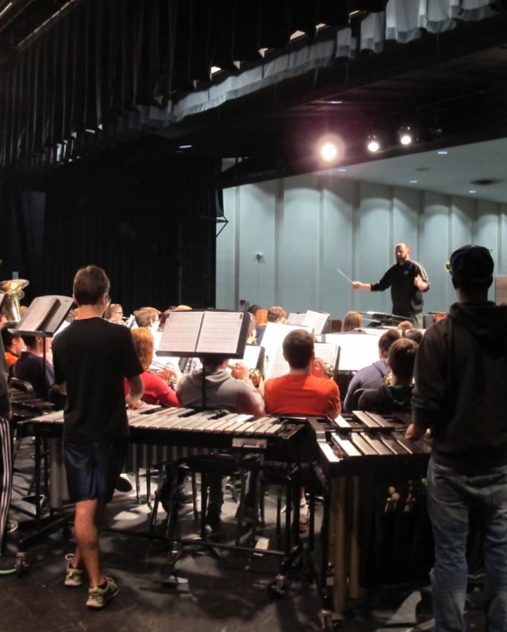 Holiday Music Practice with the Wind Ensemble, conducted by Director Nathan Oshaben.  Photo by David Girbino.