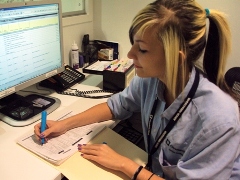 A volunteer records information for the hospital staff to use. Photo from the official Cleveland Clinic 