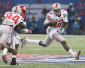 Ohio State quarterback Cardale Jones is just one college athlete who could cash-in on his collegiate success.  In this photo he runs around a block by teammate Corey Smith during the first quarter against Alabama in the Allstate Sugar Bowl and College Football Playoff Semifinal on Thursday, Jan. 1, 2015 at Mercedes-Benz Superdome in New Orleans. (Phil Masturzo/Akron Beacon Journal/TNS)