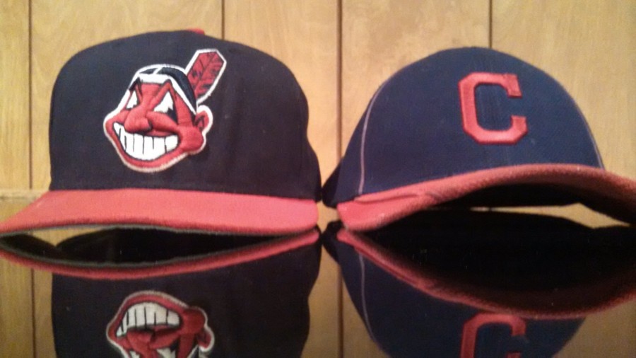 Out with the old, in with the new; the Chief Wahoo logo, shown left, and the Block C cap serving as the predecessor. 
Photo by Joe DeNardo
