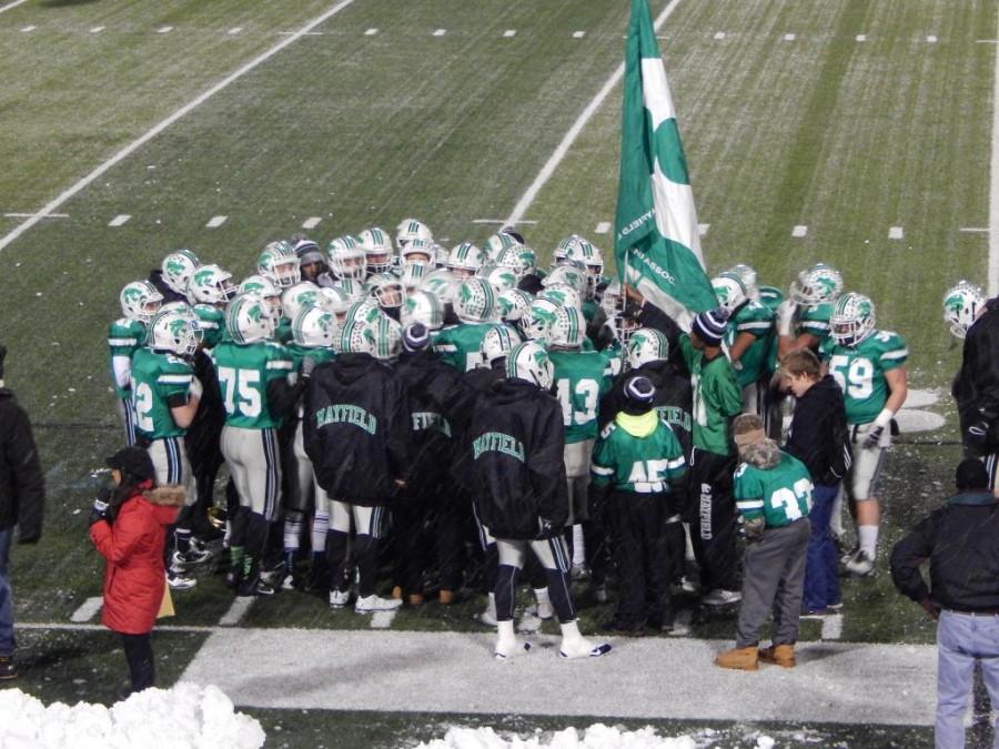 The Wildcats huddle together prior to their state semi-final match up vs. Nordonia last fall. Photo by Jared Serre.