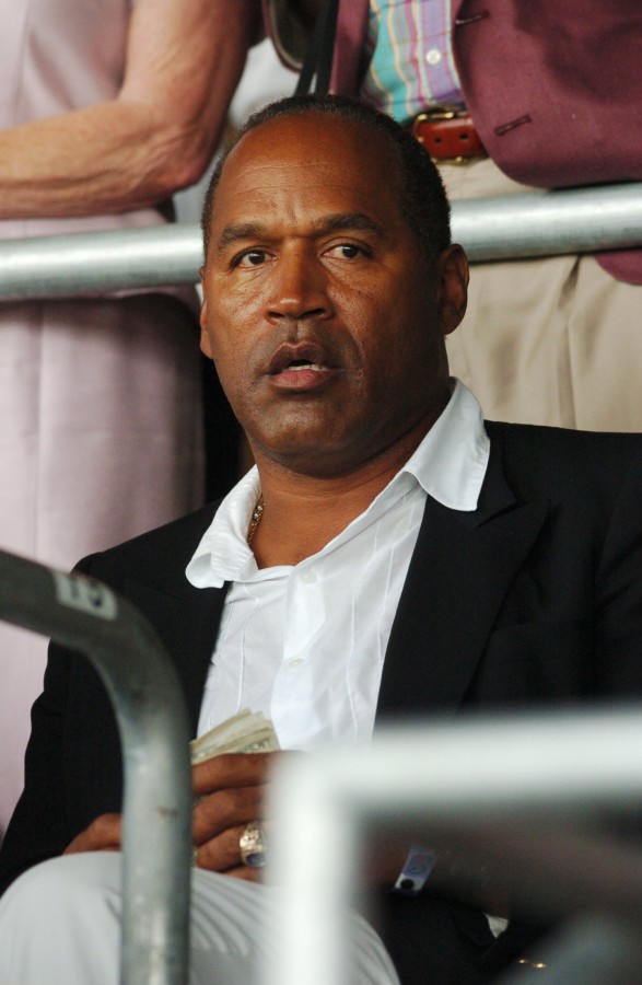O.J. Simpson looks on from a grandstand box at Churchill Downs prior to the 130th Running of the Kentucky Derby, Saturday, May 1, 2004 in Louisville, Kentucky.   Photo by STEVE DESLICH/KRT