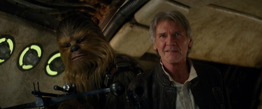 Harrison Ford returns to the Star Wars series nearly 40 years after the original movie debuted in 1977.  On the left is Peter Mayhew, who stars as Chewbacca in The Force Awakens.