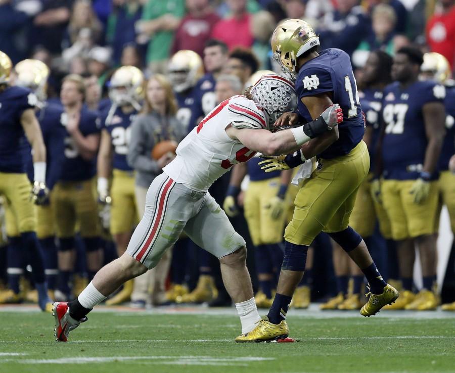 Joey Bosa (97), pictured here during the Battlefrog Fiesta Bowl, was one of 5 Ohio State player selected in the first round of the Paw Print mock draft.