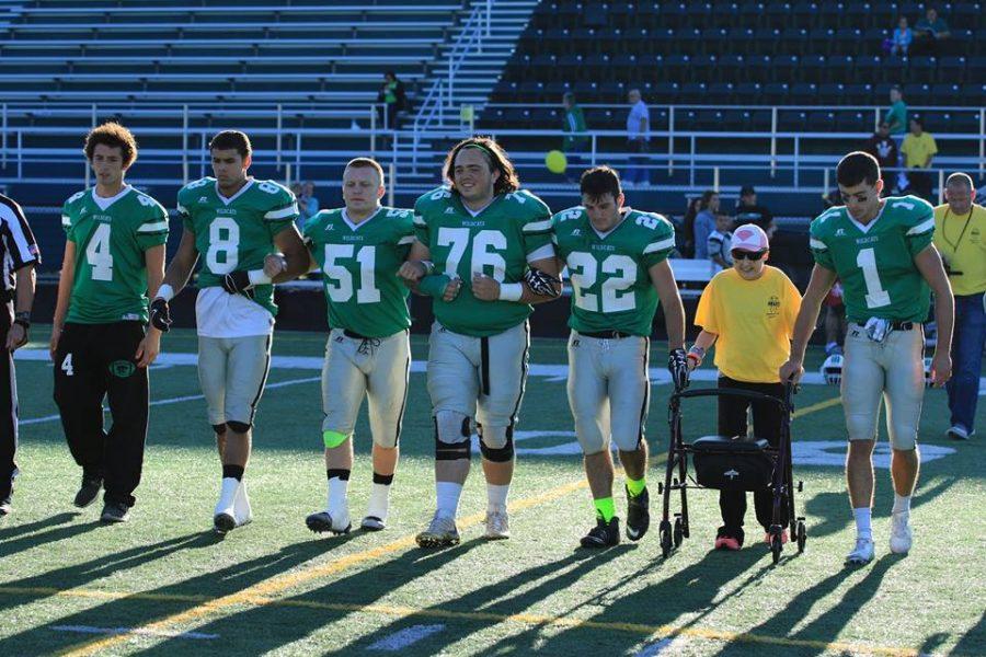 Kayla Hoover, serving as an honorary captain for the Wildcats prior to their matchup against Massilon Jackson on September 2nd. Courtesy of Mayfield Wildcat Football Facebook page.