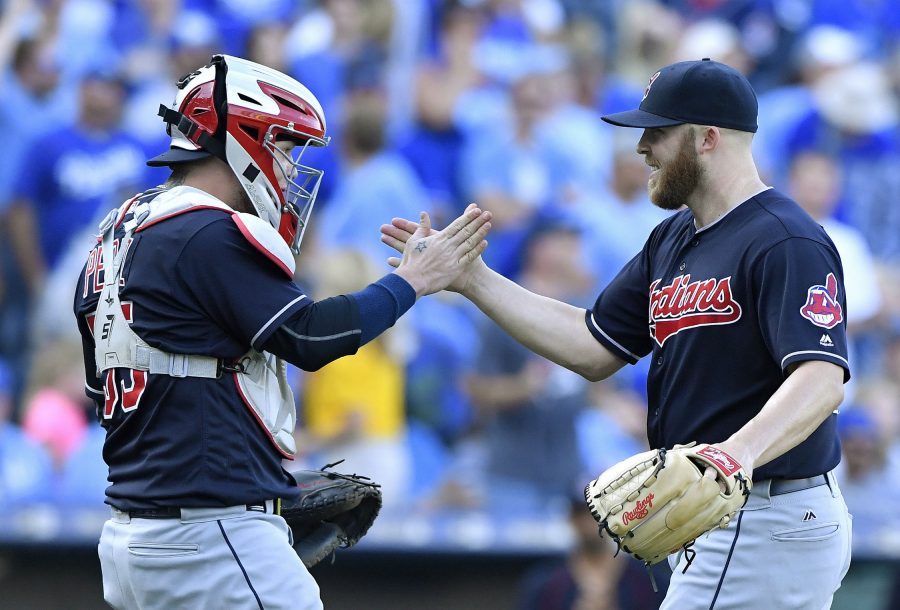 Cleveland Indians relief pitcher Cody Allen celebrates closing out the ninth inning with catcher Roberto Perez after the teams 3-2 win over the Kansas City Royals on Sunday, Oct. 2, 2016 at Kauffman Stadium in Kansas City, Mo.