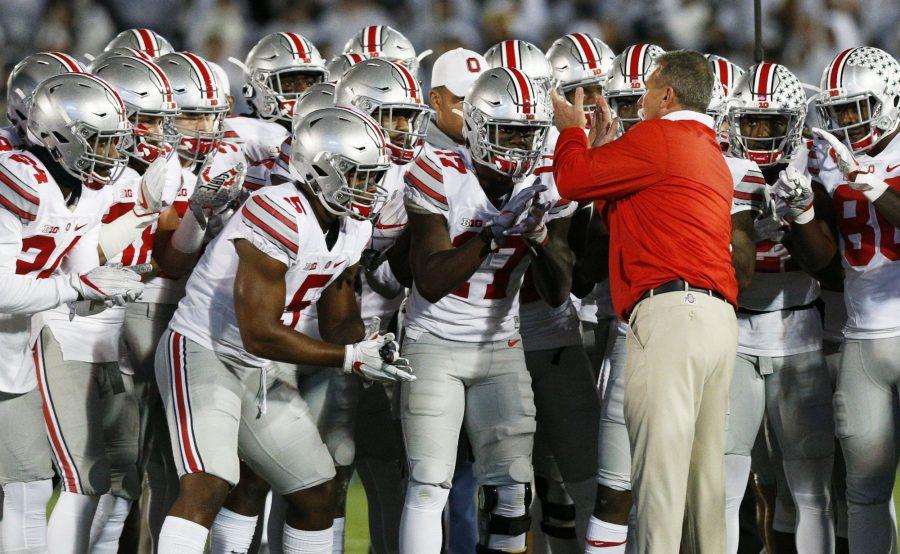 Ohio State head coach Urban Meyer pumps up his team before taking on Penn State on Saturday, Oct. 22, 2016, at Beaver Stadium in State College, Pa.