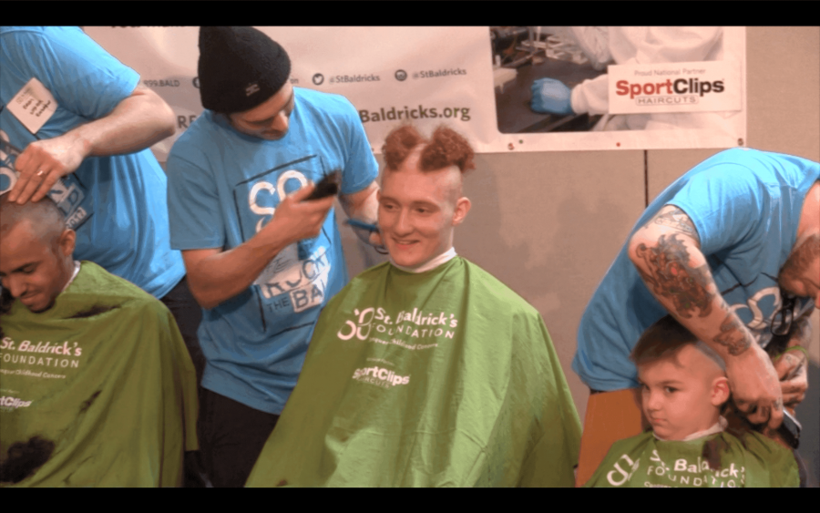 Senior Nedal Eid gets his hair shaved at Cleveland Clinic on Friday, March 10.  