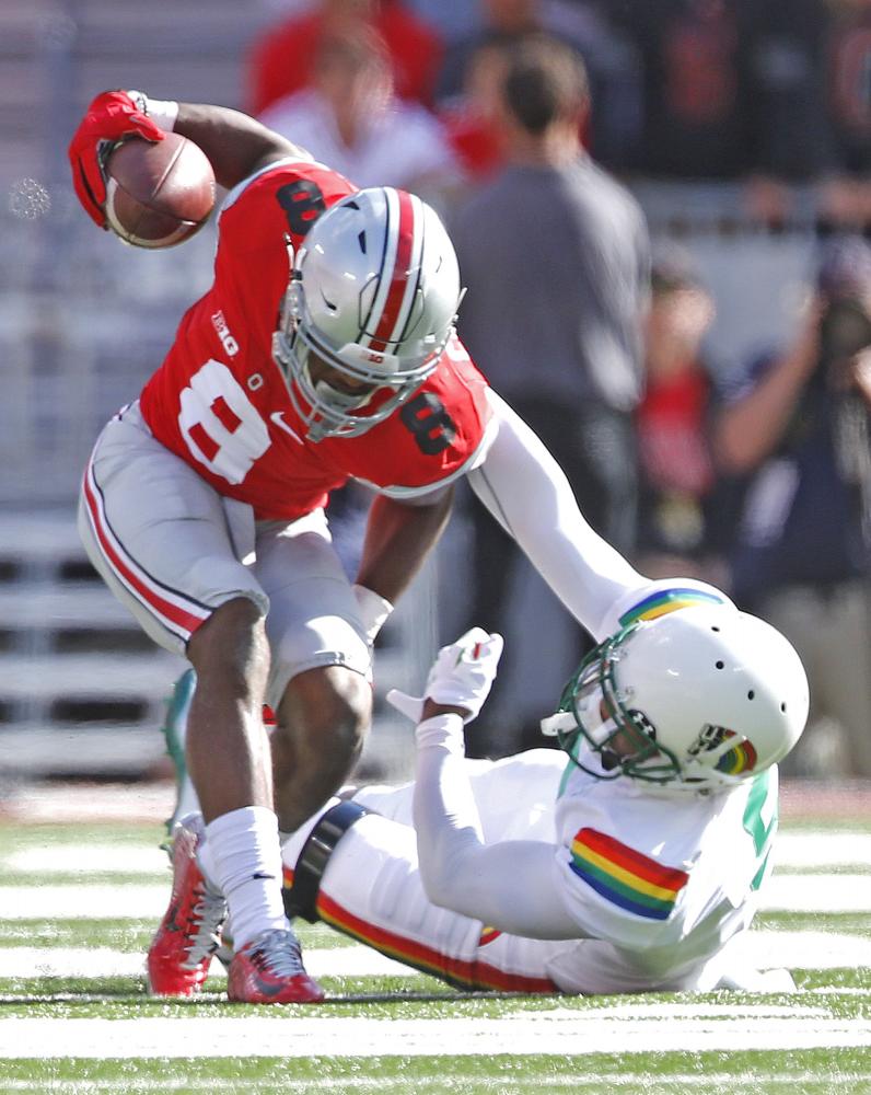 Former Ohio State defensive back Gareon Conley intercepts a pass in a 2015 game against Hawaii. Conley was drafted later than predicted after a young woman alleged that Conley raped her in a Cleveland hotel.