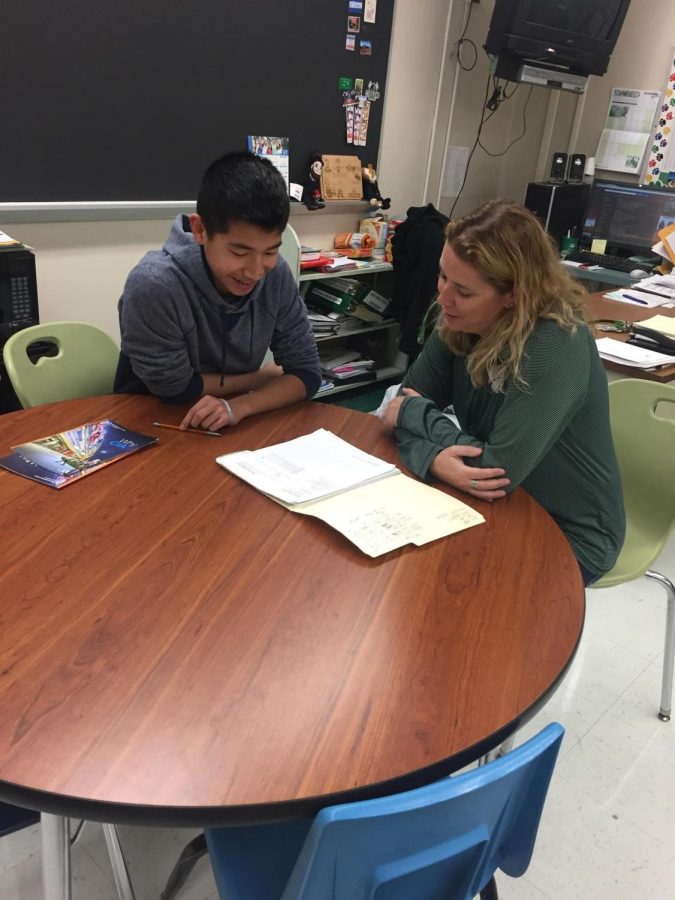 If homeroom is eliminated, students may have advisory time to work on-on-one with staff members.  Pictured: Trenton Lam and AEP teacher Jen Hyland. 