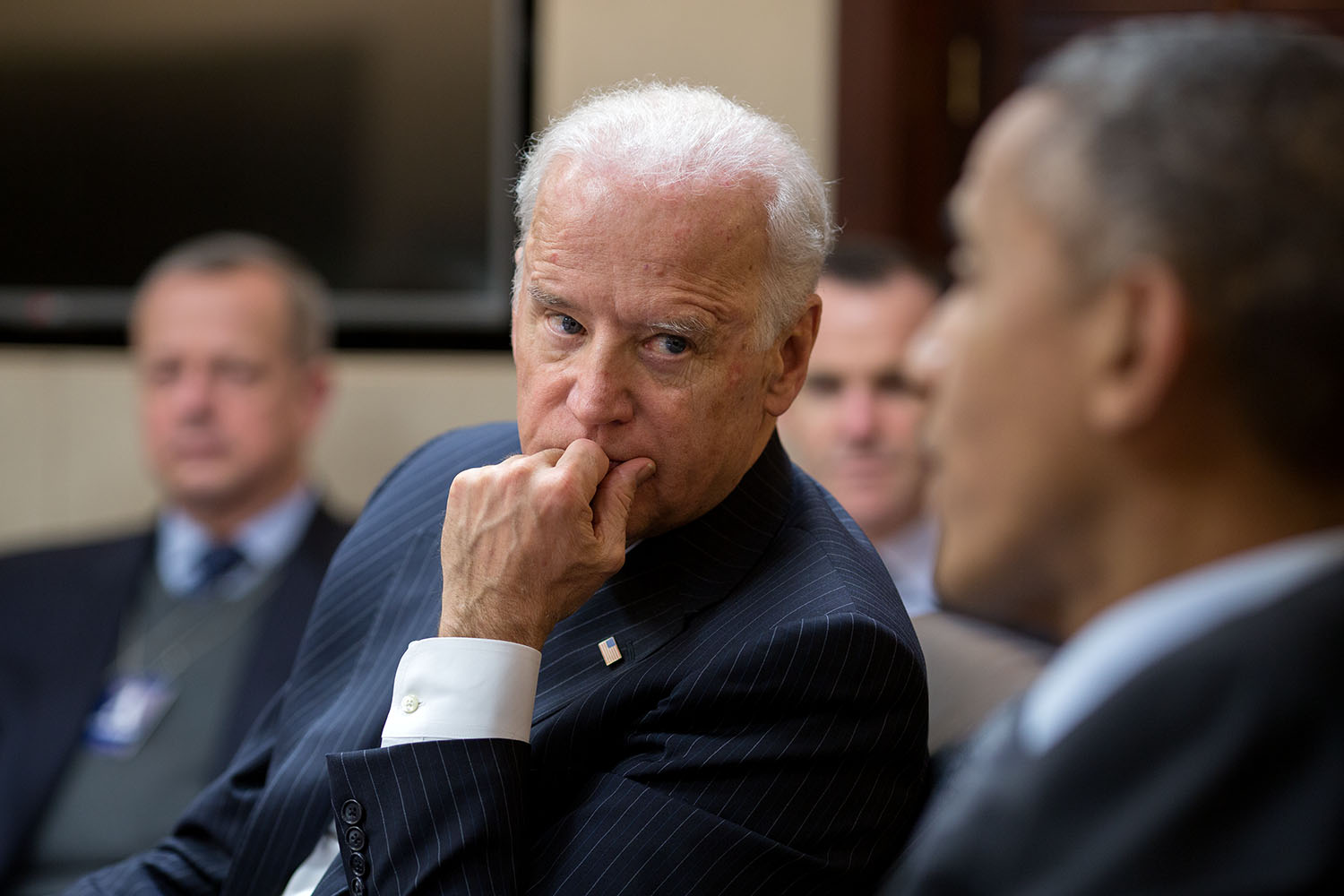 Vice President Joe Biden listens to President Barack Obama during a meeting in the Situation Room of the White House, Feb. 2, 2015.