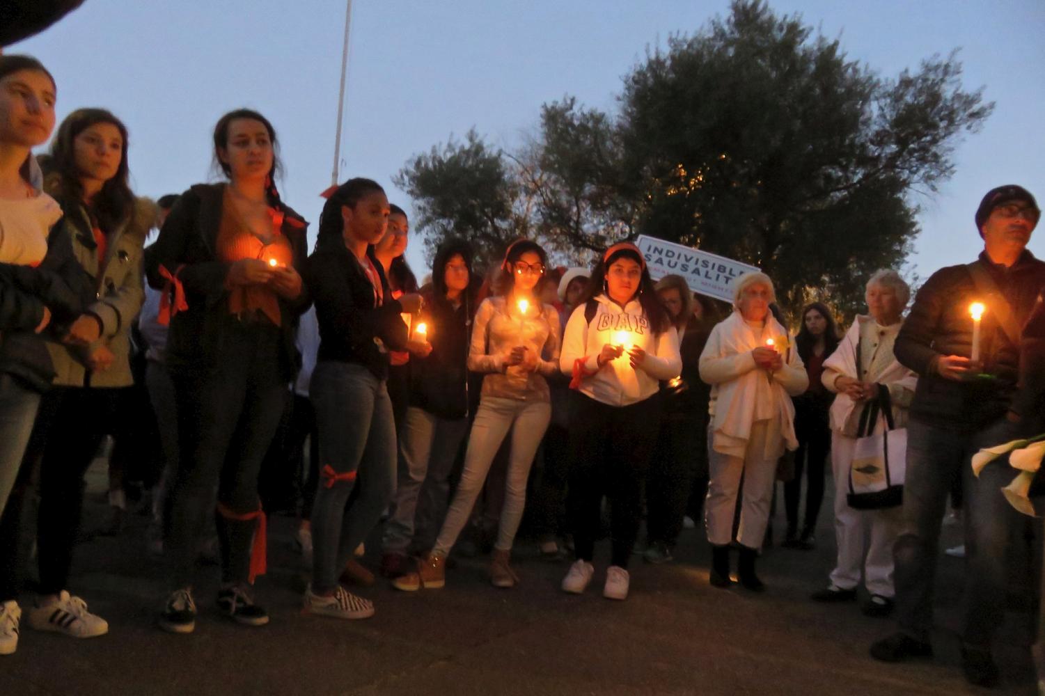Students at Tam High School hold a candlelight vigil for the victims of the recent school shooting in Parkland, Florida.