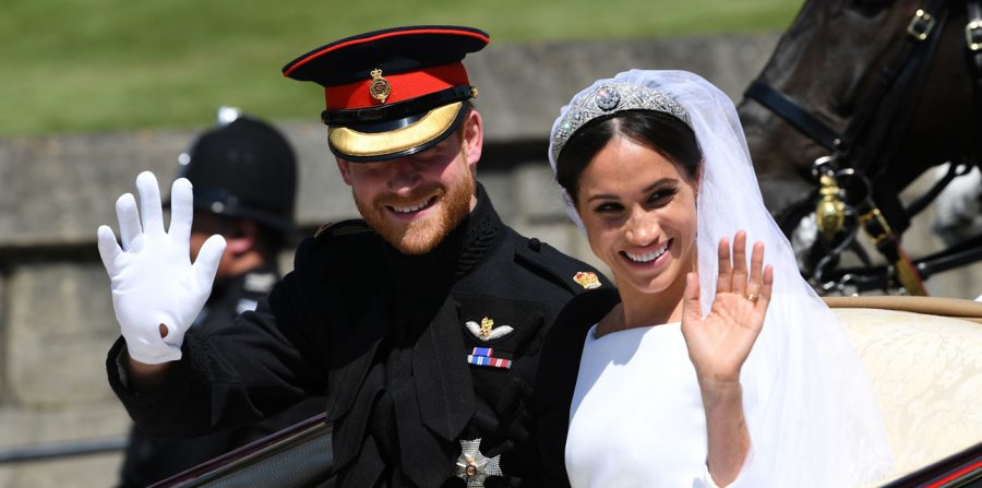 Prince Harry and Meghan Markle ride in an Ascot Landau after their wedding ceremony to Prince Harry at St. Georges Chapel in Windsor Castle.