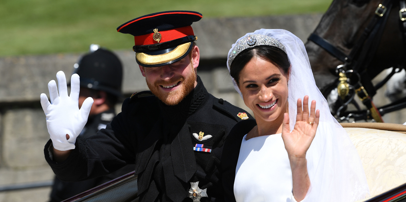 Prince Harry and Meghan Markle ride in an Ascot Landau after their wedding ceremony to Prince Harry at St. George's Chapel in Windsor Castle.