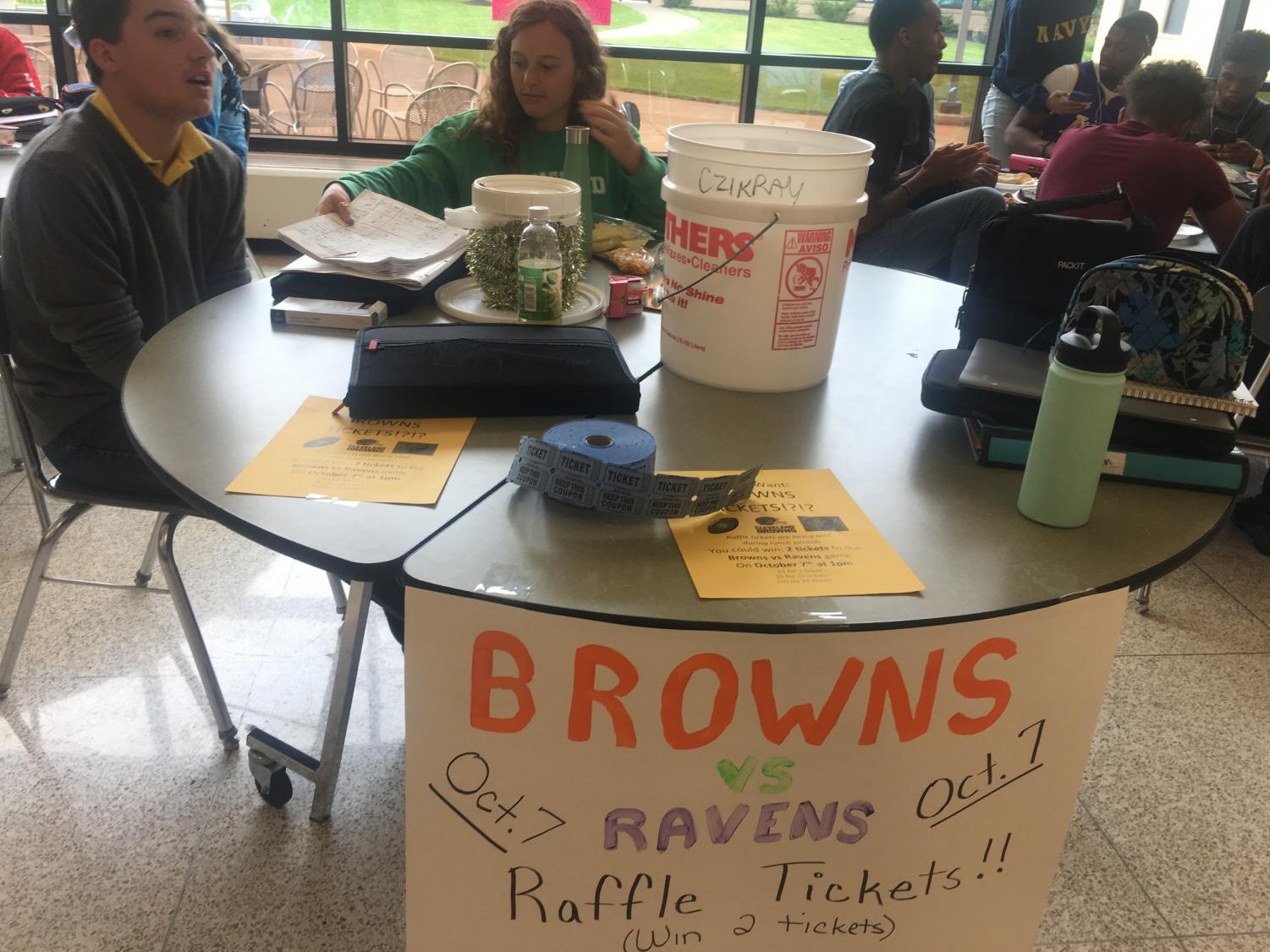 Senior and co-president of Cats Cabinet Elizabeth Reisman sells raffle tickets during her lunch period. Reisman and many other MHS students keep busy with clubs and sports.