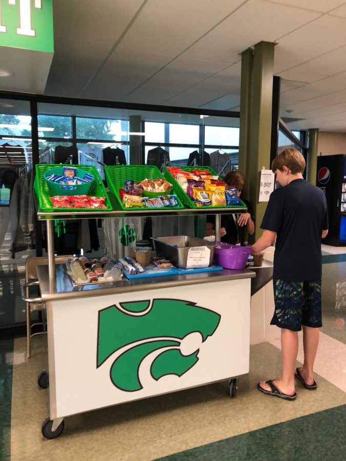 Sophomore Ethan Barnes purchases breakfast on his way to first period.