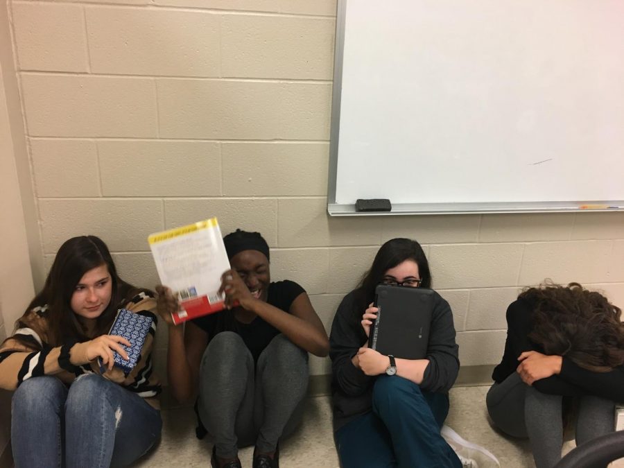 Students effectively get into the lockdown position while the ALICE process is beginning. 
