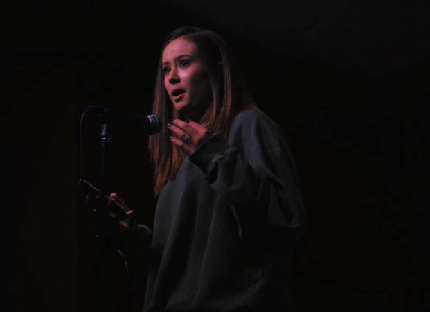 Grace Yoo shares her talent by speaking poetry at a local event.