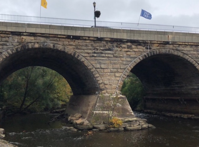 Students watched the bridge over the Cuyahoga River during a poetry reading