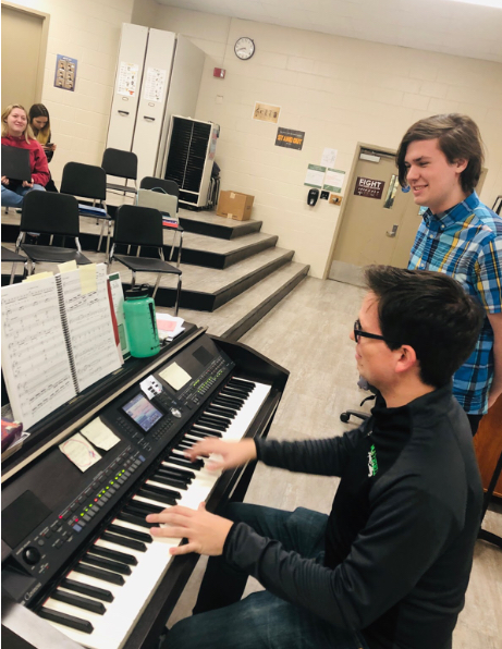 Brian Fancher (front) rehearses an audition song with Nick Korzhiletsky as he prepares to audition for the role of Lord Farquad.