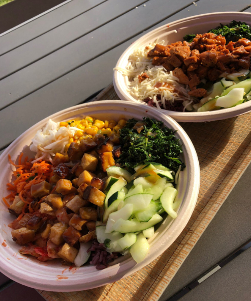 Customized rice bowls with seasoned chicken and crunchy tofu are packed with fresh vegetables and all sauces on the side.
