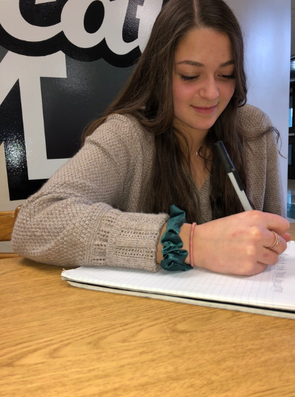 Principal Advisory Committee member, Gianna Ferrante works on a list of new classes she wants to see at the school in the future.
