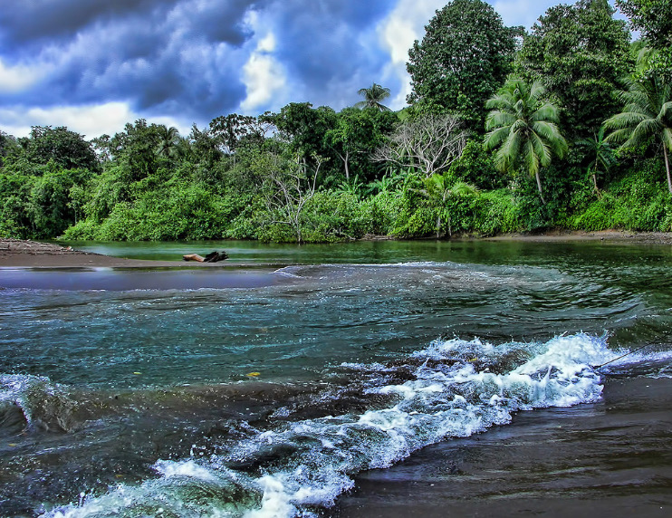 Water in Costa Rica splashes up on the shore. 