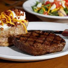 The eight ounce sirloin steak comes with a loaded baked potato and house salad. 