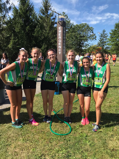 Senior Anna Blum, freshman Emma Burkey, junior Savannah Bresler, sophomore Hailey Nelson, and juniors Alexis Ochi and Nikki Davis celebrate a first place victory at VASJ meet