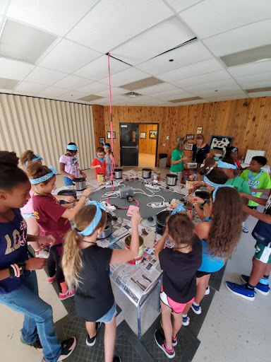 The counselors spent their time at Camp Fitch leading and participating in various activities, such as candle making with the kids. 