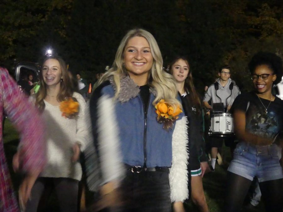 Members of the Sweet Sixteen, including Julianna Nicolli (left), Sydney Nicolli (center), and Bri Mosley (right), have needed to dress up multiple times in the last two weeks.  They are seen dancing The Funk at the Hoco bonfire on Wednesday, Oct. 23.