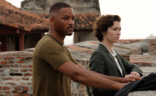 Henry (Will Smith) and his sidekick Danny (Mary Elizabeth Winstead) assess their surroundings in a scene from Gemini Man.