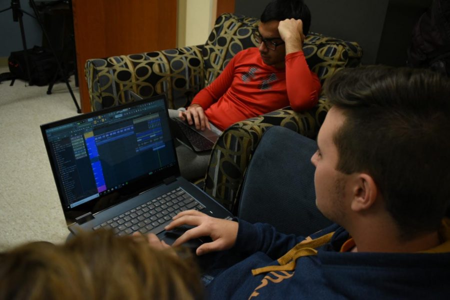 MIX AND MASTER: Shane Besselman shares his work with sophomore Monti Yoo.  Senior Indy Dhillon works alongside them in Mr. Bokovitzs classroom.