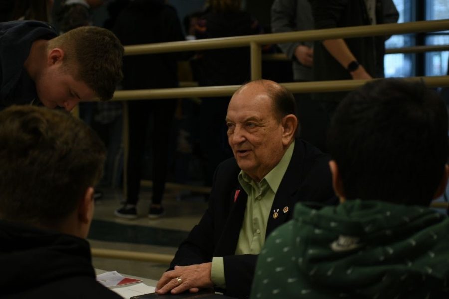 Students have a conversation talking to one of the many “human books” at the human library.