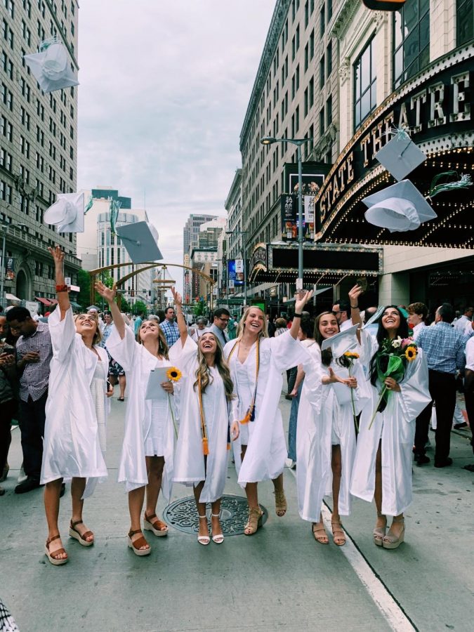Students in the Class of 2019 celebrate in Playhouse Square after their graduation.  This year’s senior class officers are preparing for the big day approaching, making sure kids have their cap and gown forms as well as all the other jobs to be done. 