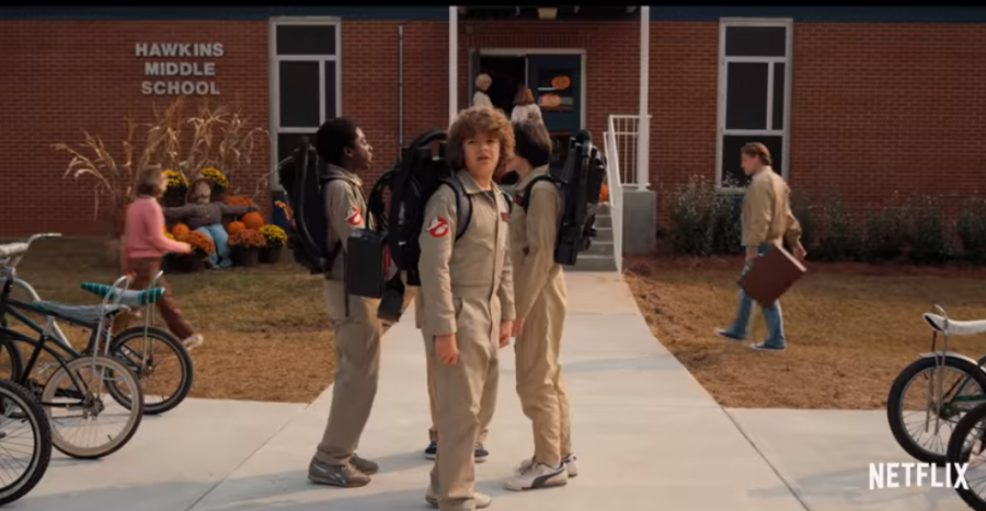 Dustin Henderson and his friends dress up as Ghostbusters for Halloween at school.