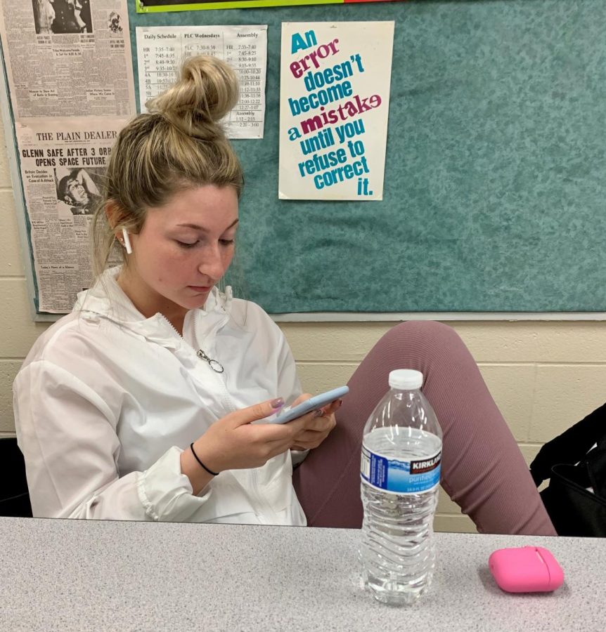 Senior Sydney Nicolli spends time in class watching TikTok videos. 