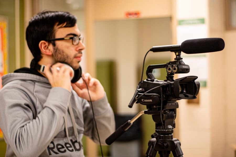 LIGHTS, CAMERA, ACTION: Senior Indy Dhillon films a segment for the weekly show “Wildcat Weekly.  Dhillon and many other students won’t be able to have the luxury of using Mr. Bokovitzs state-of-the-art equipment for a long time.