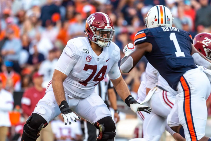 BIG BLOCKER: Jedrick Wills Jr, 74, blocks an Auburn defensive lineman in a game last season. Wills was the 10th pick in the 2020 NFL Draft and will play for the Cleveland Browns this fall.