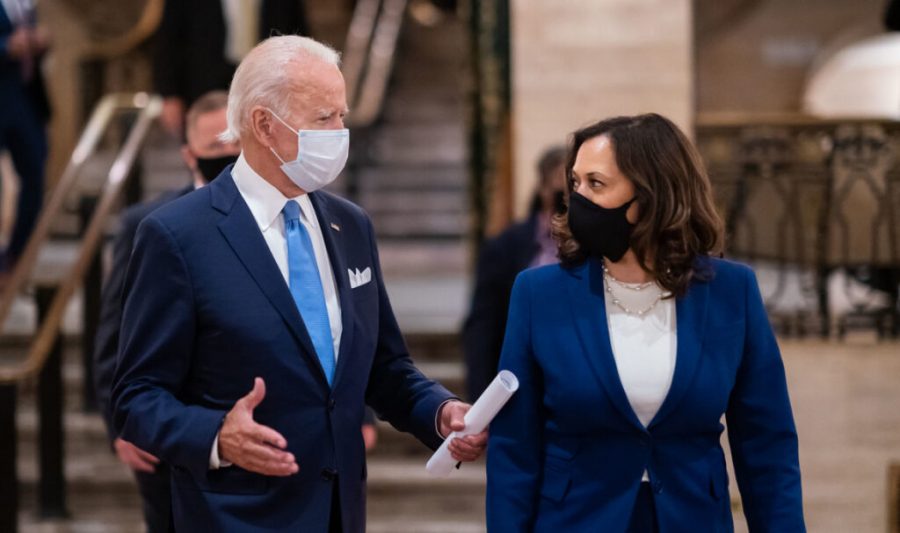 Presidential candidate Joe Biden criticizes Donald Trump for not promoting mask-wearing.  Biden and Kamala Harris wear a mask during all public appearances.