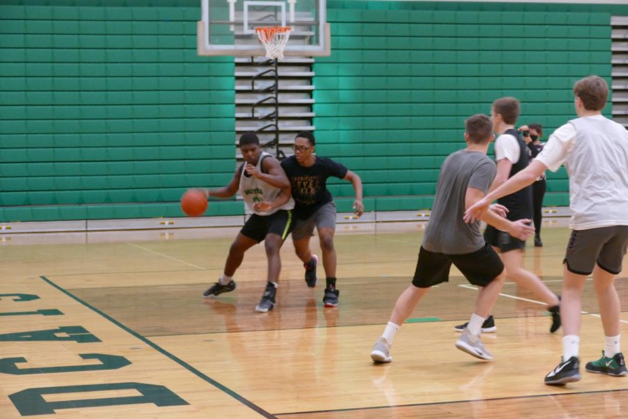 Junior Noah Adams competes in a pre-season practice with his teammates.