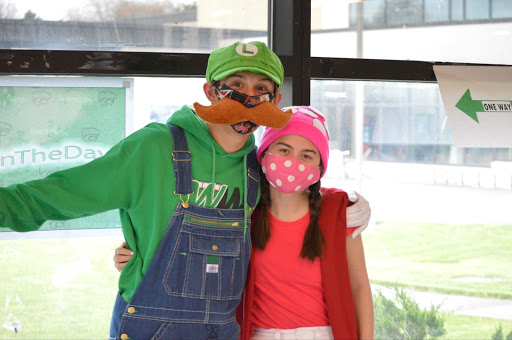 As part of the Senior Celebrity fundraiser, Johnny Gaudio and Alexis Ochi dress up as Mario Brothers characters.  