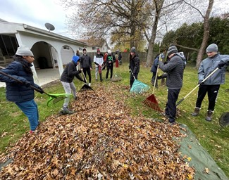 Interact club adviser Jerry Turk appreciated the way his club and NHS club members worked together to rake leaves in Mayfield Heights. 
