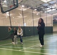 During a SMILE4LIFE club member, adviser Kerry Rutigliano discusses the teacher appreciation announcements with her students.