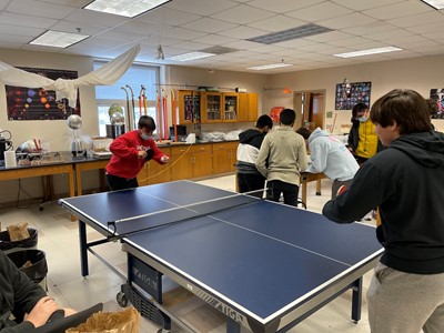 During lunch in late November, Andrew Ferenac battles Mike DelBalso in a ping pong match.  Adviser Bill Selent said this is the second time the school has had a Ping Pong Club.  “Years ago, the previous club lasted about three years, but we lost too many people in the end because a lot of members had sports or work preventing them from coming. Now there are more people again, he said.