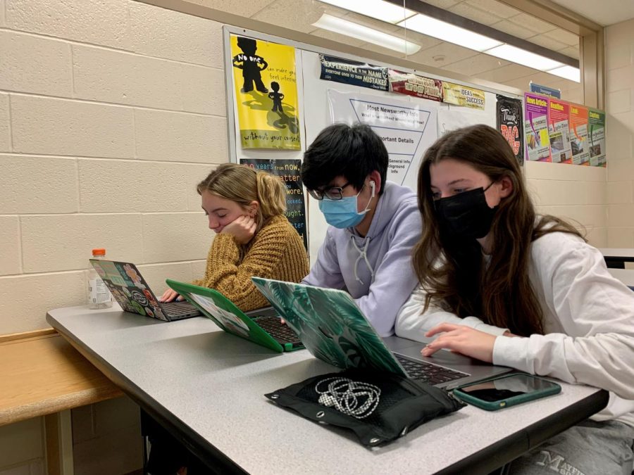 During their CCP English class, sophomore Morgan Palazzo, senior Ethan Fong, and senior Amanda Patrick work on their argument essays.  During the 90-minute block period, the three have many opportunities to discuss their research and to confer with their teacher, but they also have fewer overall hours in class to complete their coursework.