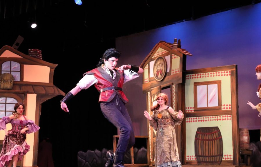 During+last+Thursdays+dress+rehearsal%2C+seniors+Patrick+McAllister+sings+and+dances+as+Gaston.