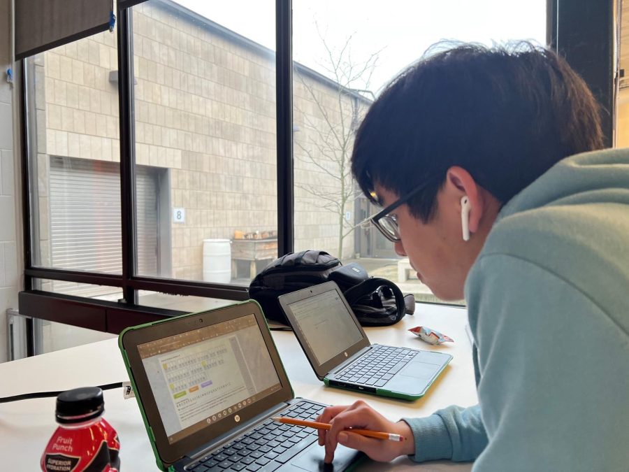 Senior Ethan Fong, one of the top 40 seniors who will attend the Excellence Reception, works on a Science Olympiad code-buster assignment. 
