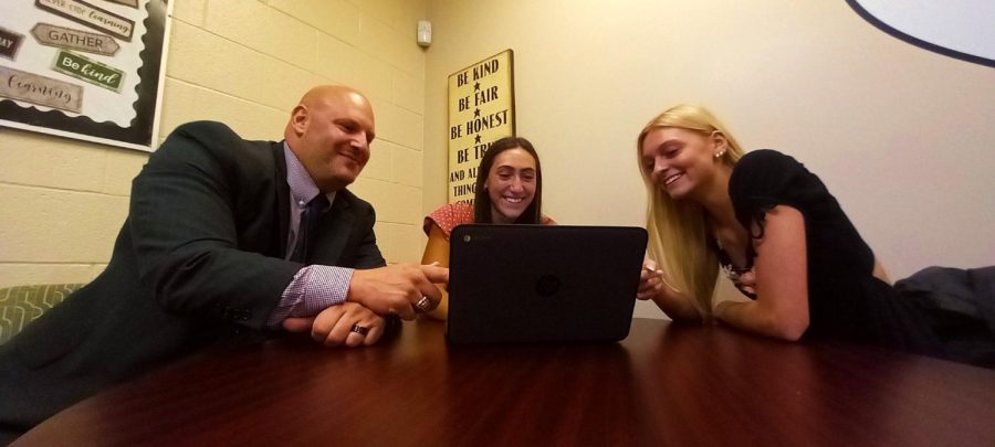 New assistant principal Daniel Sapanaro assists students Mia Palmisano and Danica Rossi in the student affairs office during 7th period on Tuesday, Sept. 13, 2022.